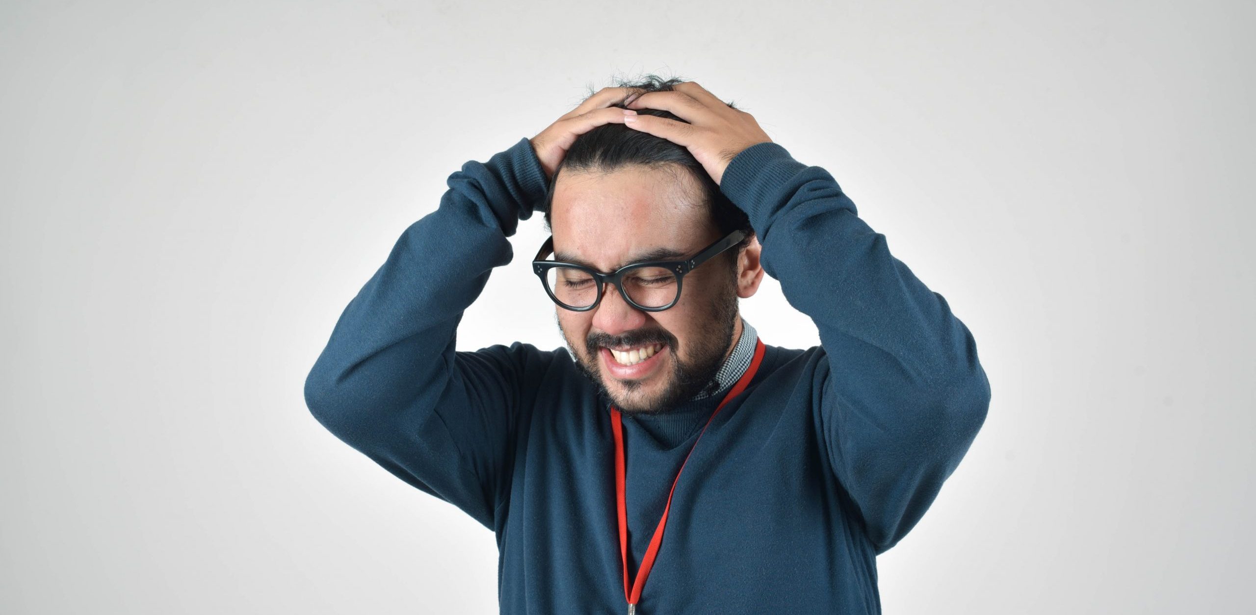 man in bluee ssweater