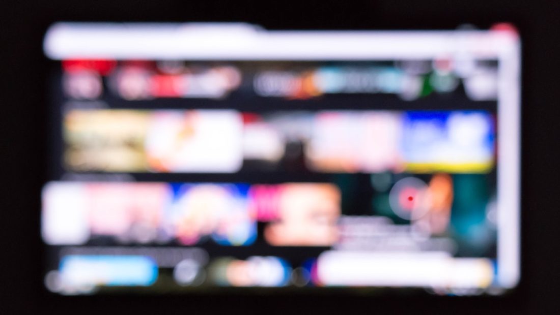 a remote control sitting in front of a television